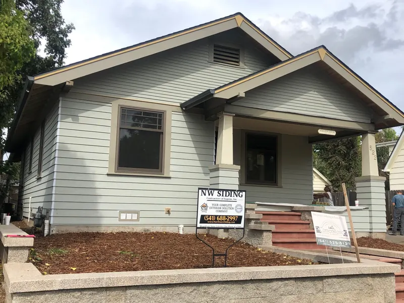 Sage green craftsman bungalow with tan trim