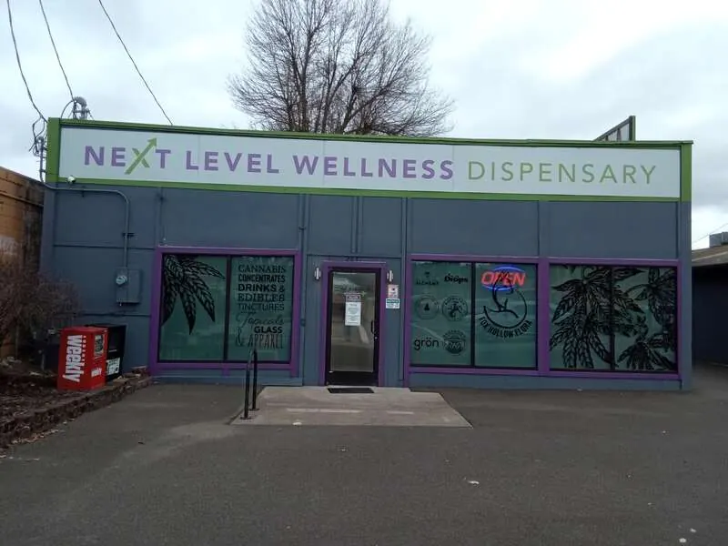 Commercial storefront exterior in gray with purple trim